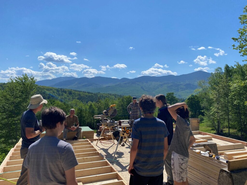 Students visiting a new building site with Adam Nyborg Environmental Building.