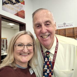 PACE Coordinator Jennifer Gilbert and School Safety Officer Mr. Louis Babin at the College Mini Fair in Littleton.